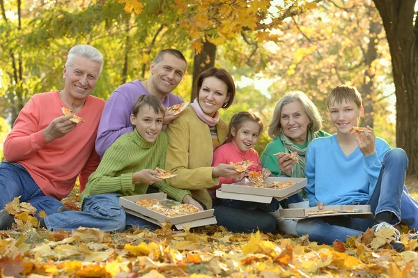 Happy family eat pizza together — Stock Photo, Image