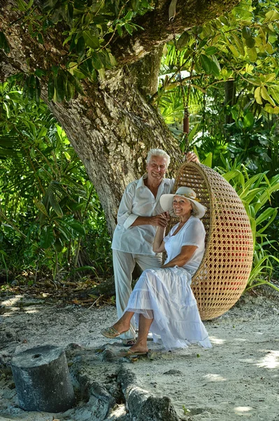 Elderly couple  in tropical garden — Stock Photo, Image