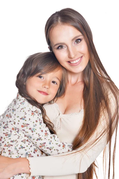 Beautiful mother hugs her daughter — Stock Photo, Image