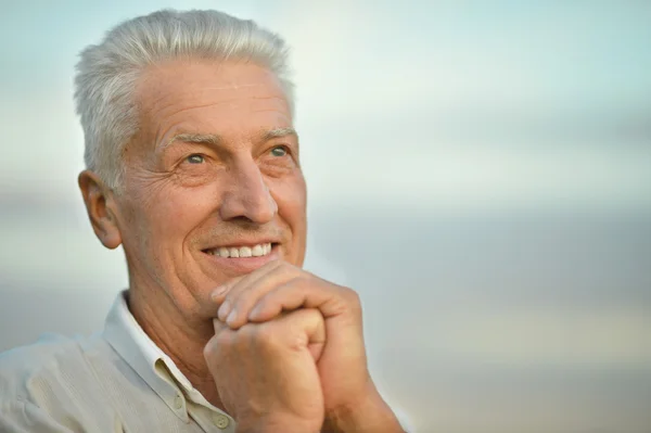 older man on  background of the sky