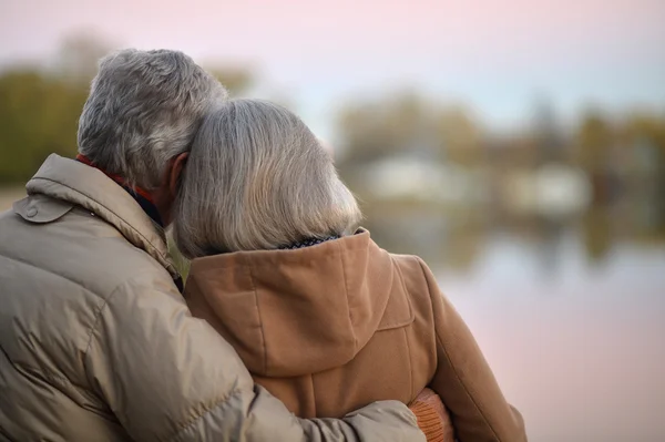 Happy senior couple  near river — Stock Photo, Image