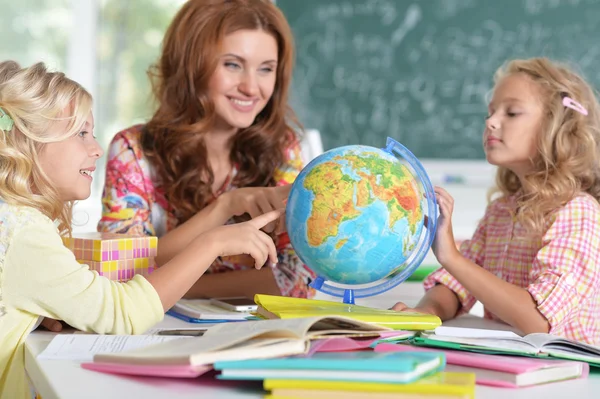 teacher with two girls at lesson