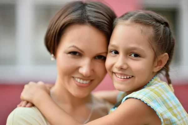 Girl with mother in park Stock Picture