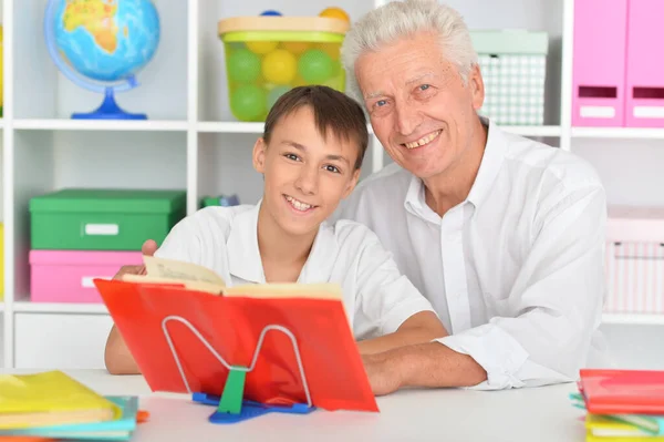 Grandfather Grandson Doing Homework Home — Stock Photo, Image