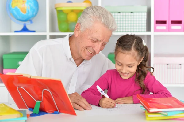 Cute Girl Doing Homework Grandfather Table Home — Stock Photo, Image