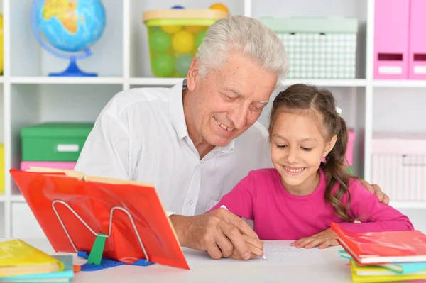 Little Cute Girl Doing Homework Grandfather Table Home — Stock Photo, Image