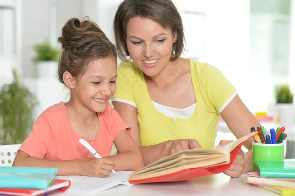 Mother Her Daughter Doing Homework Royalty Free Stock Photos