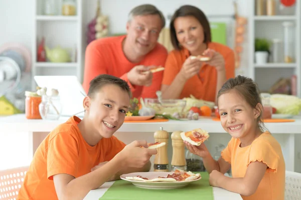 Happy Family Eating Pizza Together — Stock Photo, Image