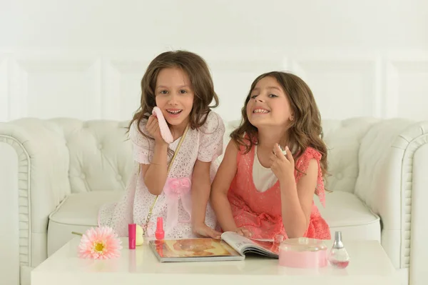 Portrait Cute Sisters Sitting Sofa Magazine — Foto de Stock