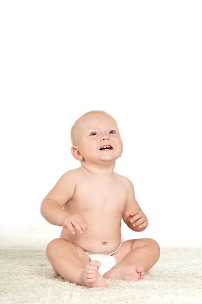 Cute little boy in pampers smiling — Stock Photo, Image