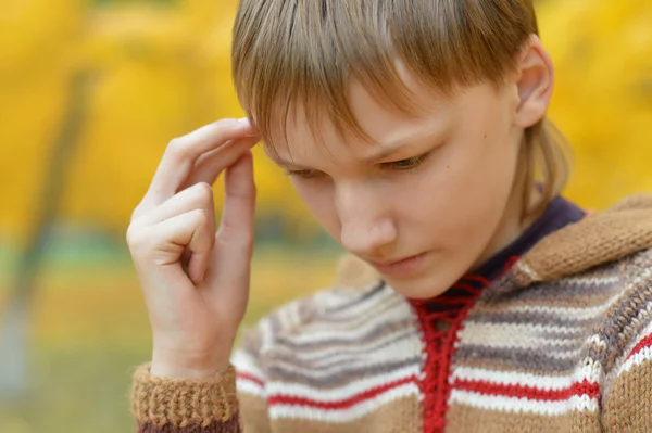 Little sad boy in a warm sweater — Stock Photo, Image