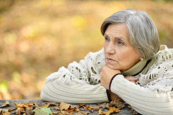 Pensive elderly woman — Stock Photo, Image