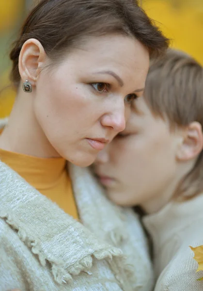 Mother with a son in autumn park — Stock Photo, Image