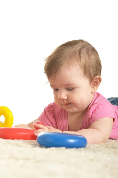 Baby girl playing with toys — Stock Photo, Image