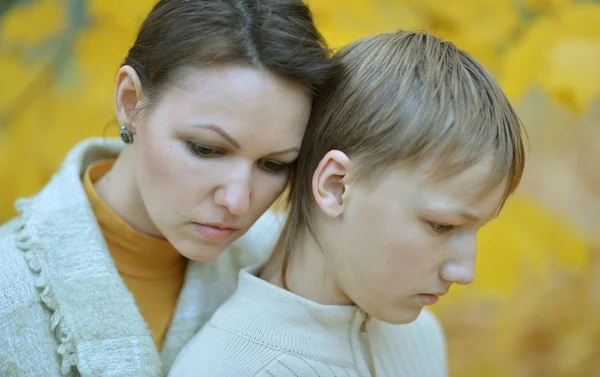 Mother with a son in autumn park — Stock Photo, Image