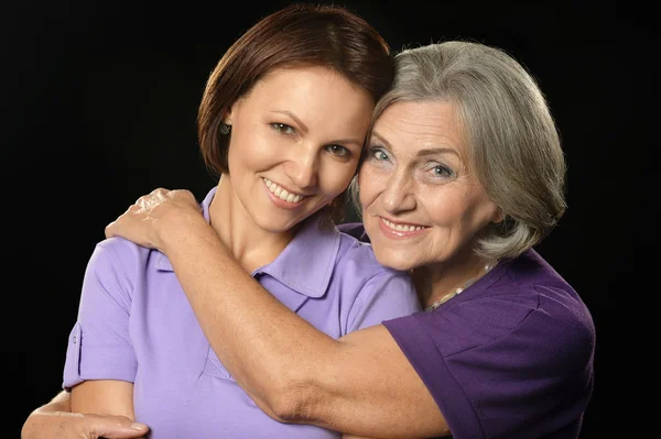 Happy mother hugging her daughter — Stock Photo, Image