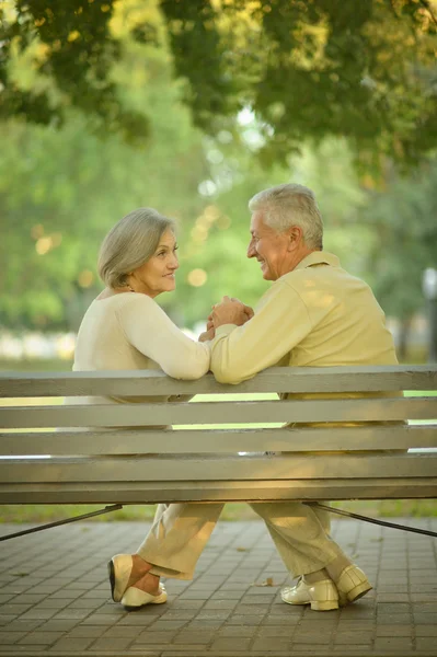 Senior couple sitting on a bench — Stock Photo, Image