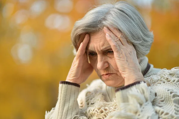 Pensive elderly woman — Stock Photo, Image