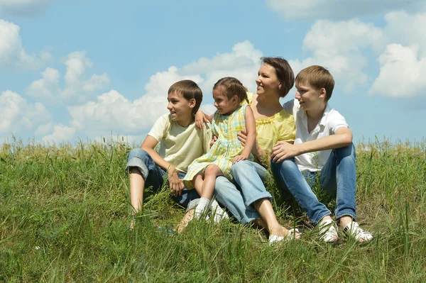 Family  in field — Stock Photo, Image