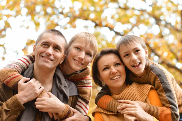 Family in autumn forest — Stock Photo, Image