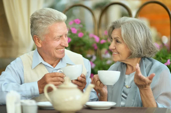 Older couple drink coffee — Stock Photo, Image