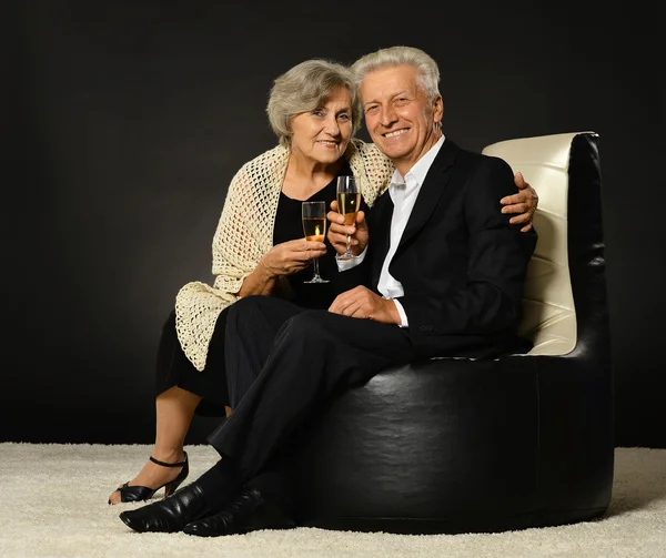 Senior couple drinking champagne — Stock Photo, Image