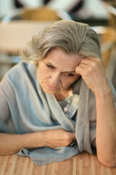 Thoughtful sad elderly woman — Stock Photo, Image