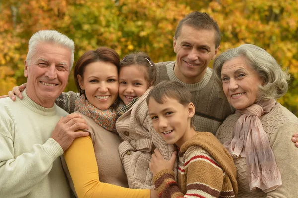 Family  in autumn forest — Stock Photo, Image