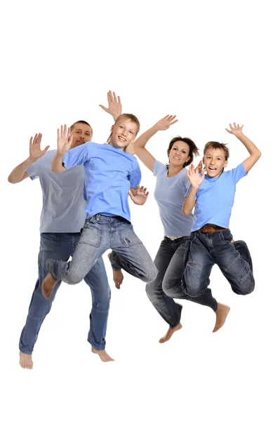 Familia saltando juntos — Foto de Stock