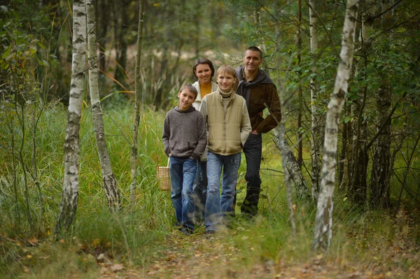 Family in autumn forest — Stock Photo, Image