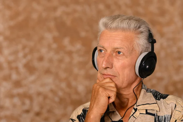 Senior man in headphones — Stock Photo, Image