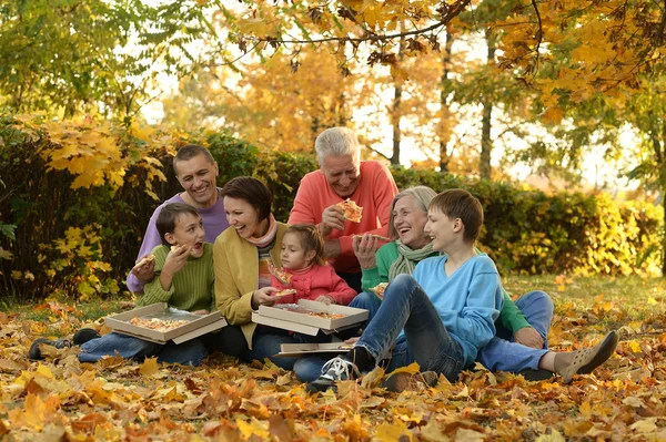 Happy family eat pizza together