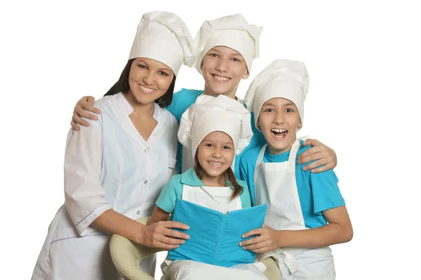 Happy female chef with assistants — Stock Photo, Image