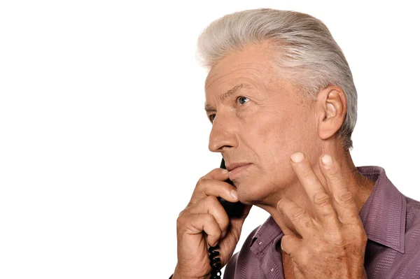 Senior man speaking on telephone — Stock Photo, Image