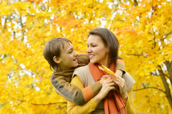 Beautiful mother with son in park — Stock Photo, Image