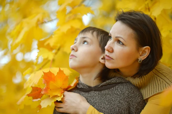 Beautiful mother with son in park — Stock Photo, Image