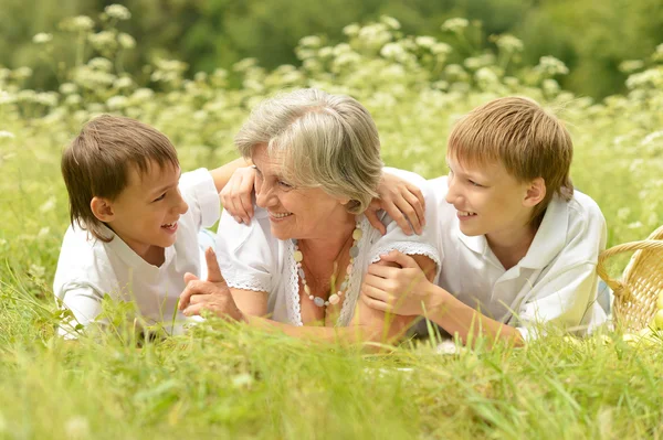 Grandmother with her grandchildren — Stock Photo, Image