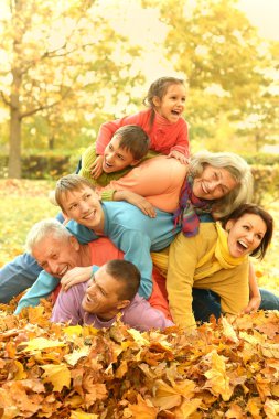 Family in autumn park clipart