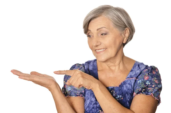 Senior woman pointing — Stock Photo, Image