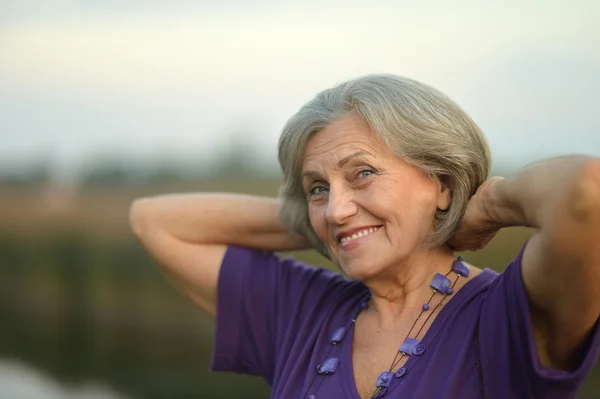 Woman near river — Stock Photo, Image