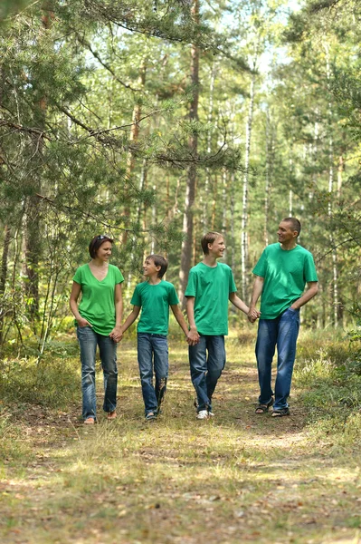 Happy family in a park — Stock Photo, Image