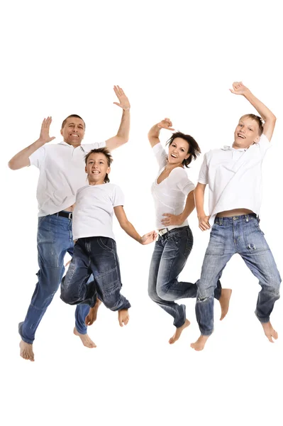 Alegre familia saltando —  Fotos de Stock