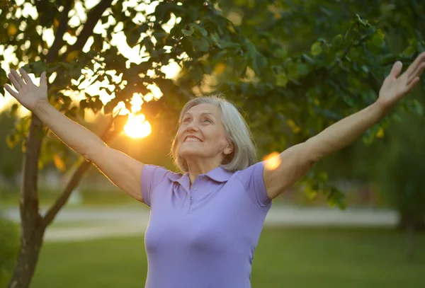 Woman stretching her hands up — Stock Photo, Image