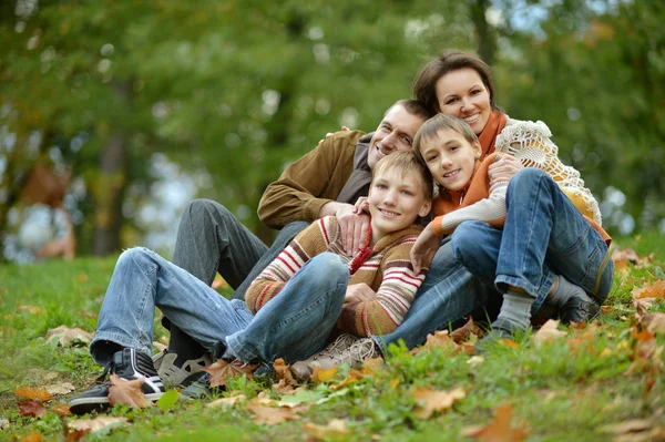 Family  in autumn park — Stock Photo, Image