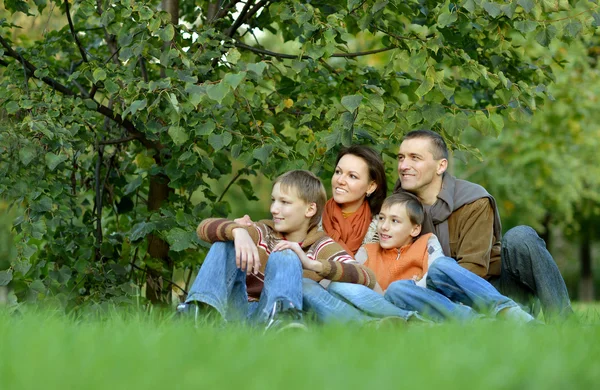 Family  in autumn park — Stock Photo, Image