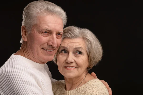 Aged couple on black — Stock Photo, Image