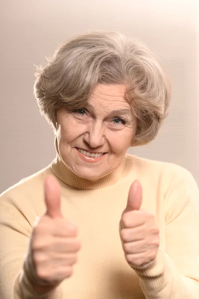 Senior lady with thumbs up — Stock Photo, Image