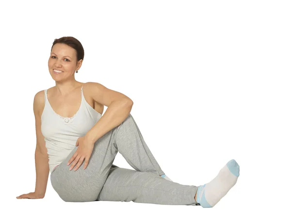 Mulher está fazendo exercícios esportivos — Fotografia de Stock