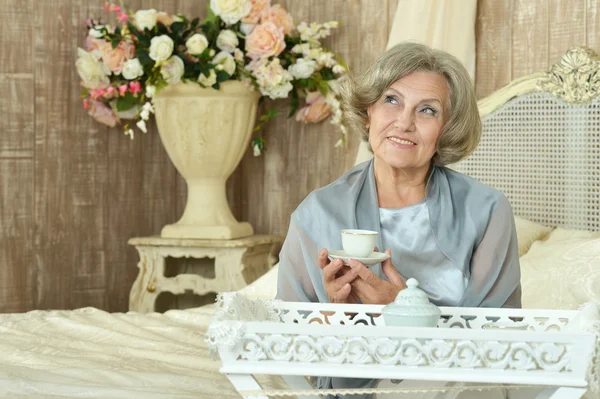 Elderly woman with tea — Stock Photo, Image