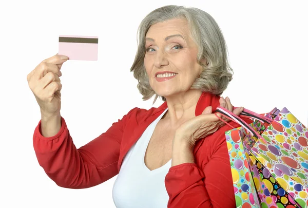 Mulher idosa com cartão de crédito — Fotografia de Stock